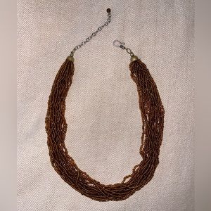 Brown bead necklace.